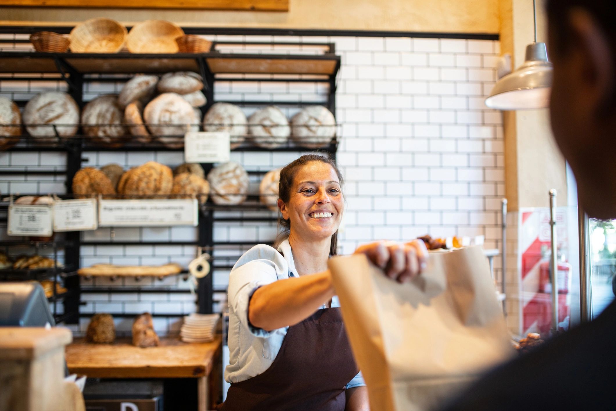 Friendly bakery staff serving customers